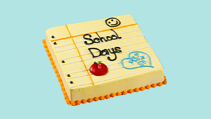A school themed birthday cake with a cartoonish design.